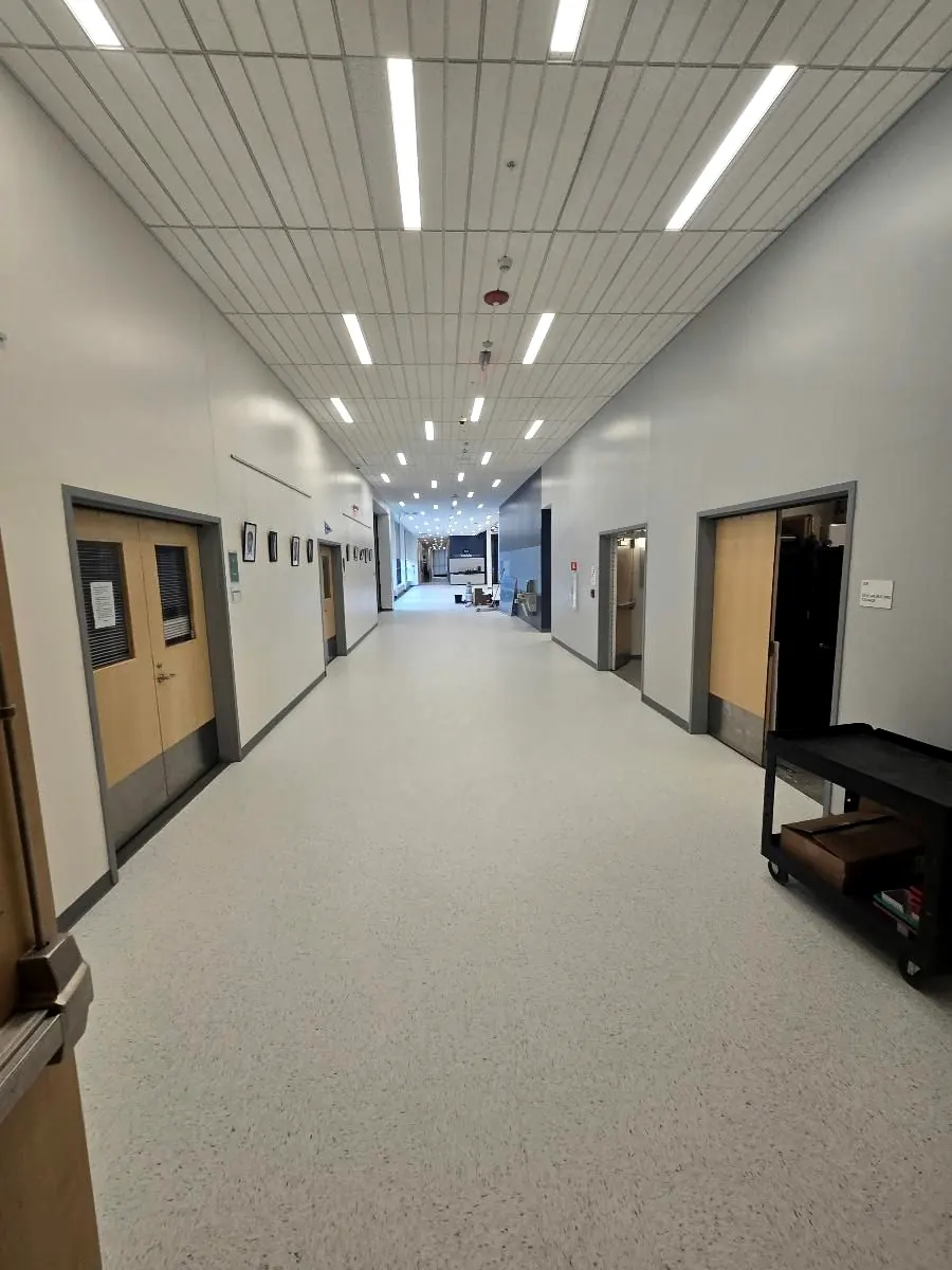 Long school corridor with newly installed resilient flooring at Brooke High School