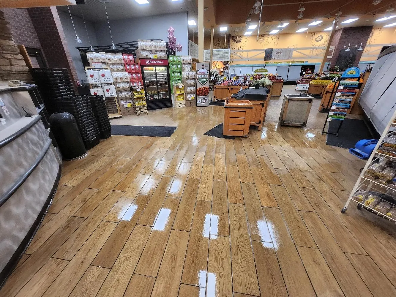 Freshly installed wood-look plank floor in an open grocery store